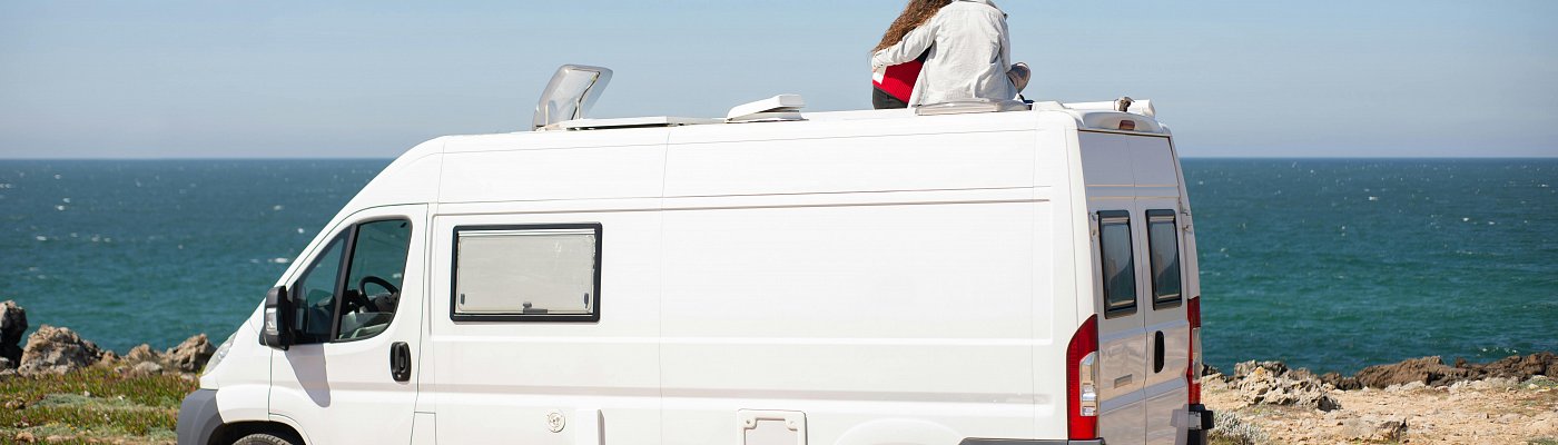 Banner image of a campervan looking out to see